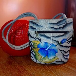 Vintage hand painted leather Anushka shoulder bag with Hibiscus theme.